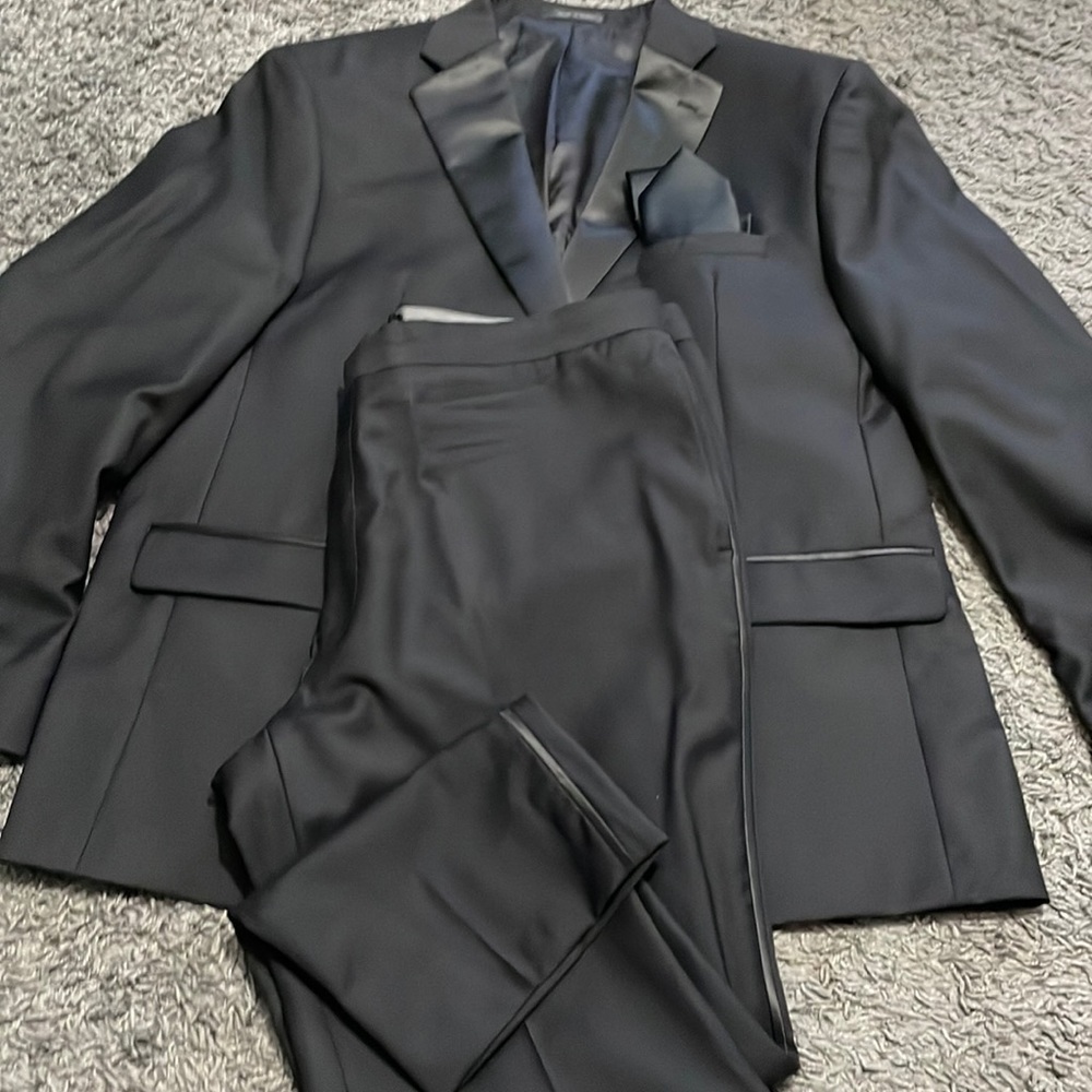 Black slim fit Calvin Klein tuxedo and black satin tie. By Jos. A.Bank Reserve.
